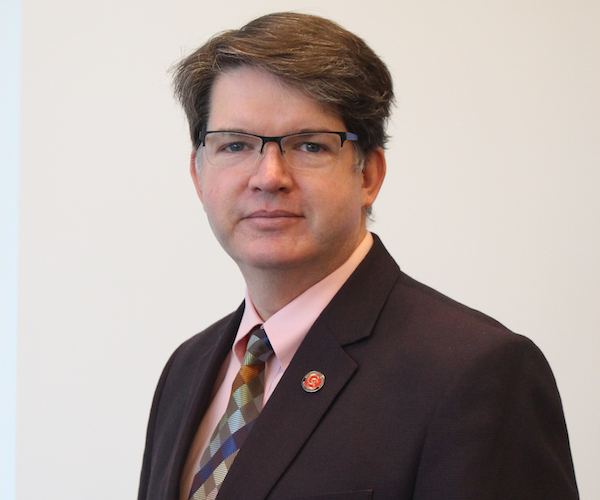 A headshot of Mark Johnson.